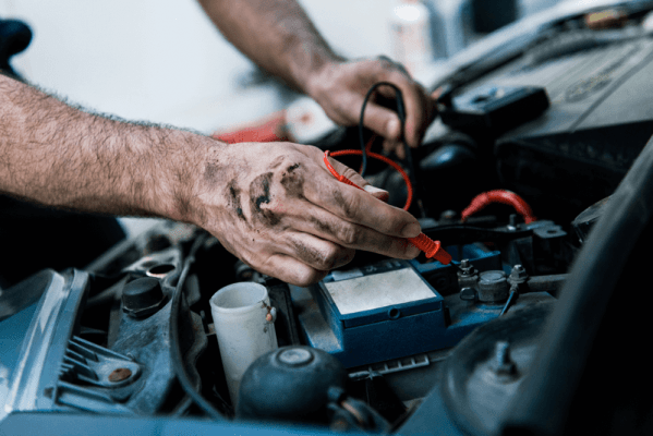 Auto Mechanic repairing car