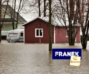 Natural Disaster - Flooded garage and truck - Franek Tax Services