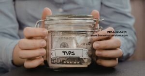 Occupational Tips - Man holding jar of cash - Franek Tax Services